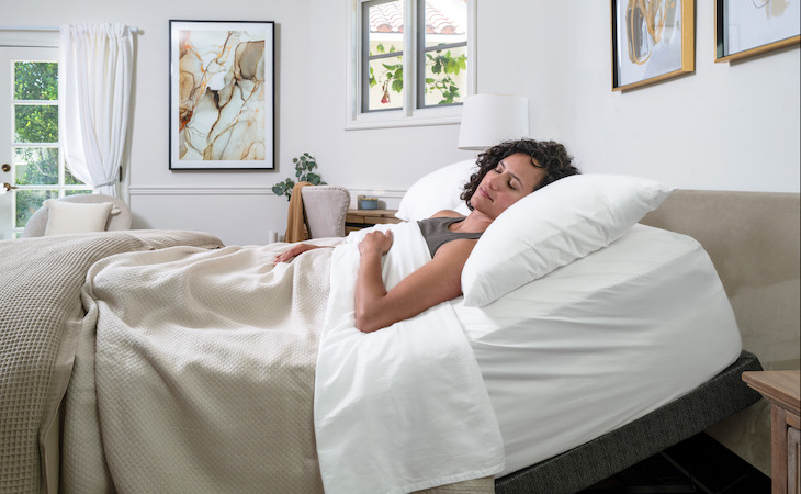 woman sleeping on saatva adjustable base plus